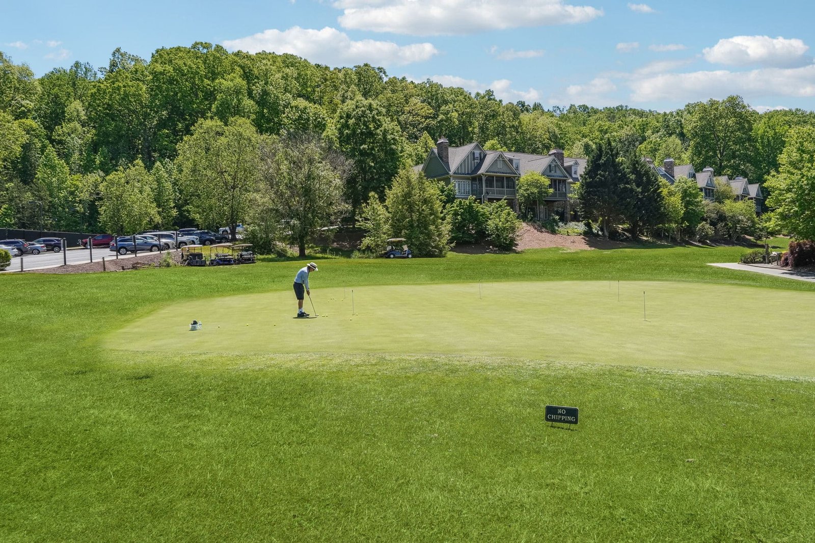 Golfer on the Jack Nicklaus Signature putting green at Achasta Golf Club, Dahlonega GA